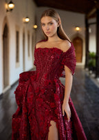 Close-up of the burgundy bridal gown corset bodice, highlighting the dense 3D petal appliques, shimmering sequins, and the artistic fine-ribbed off-the-shoulder collar drape.