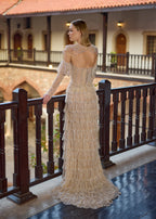 Back view of the transformative hand-beaded champagne reception dress, showing the low open-back design, the draped back collar chains, and the sweeping tiered fringe puddle train.