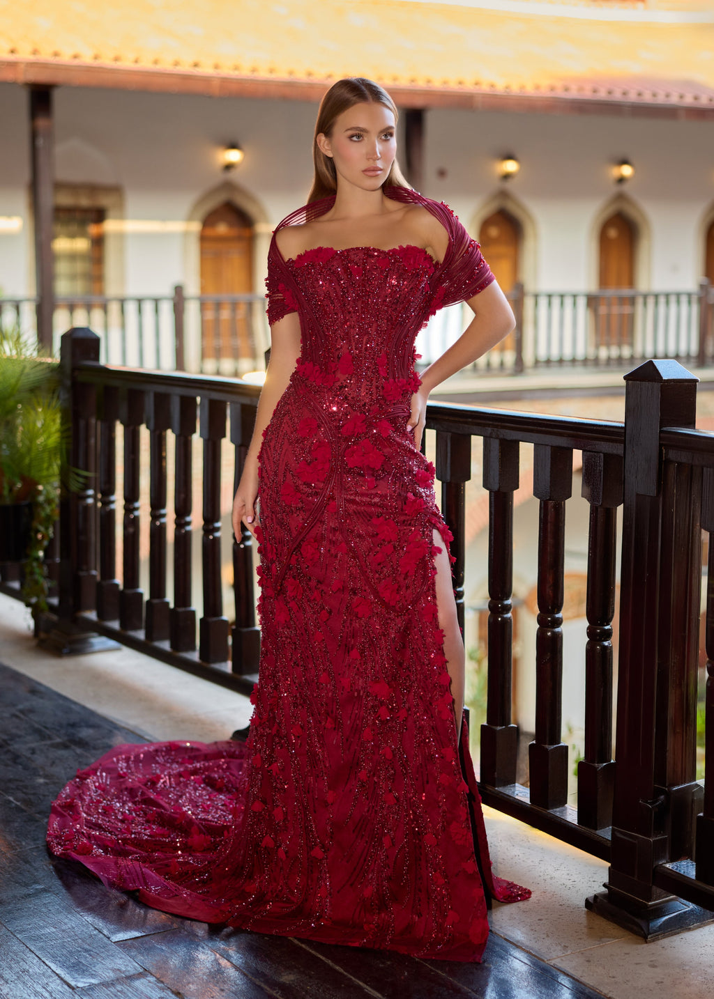 Full-length front view of the inner burgundy mermaid henna dress with the outer skirt detached, showcasing a thigh-high leg slit, hand-applied 3D flower petals, and a unique off-the-shoulder ribbed draped collar.