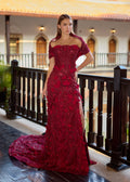 Full-length front view of the inner burgundy mermaid henna dress with the outer skirt detached, showcasing a thigh-high leg slit, hand-applied 3D flower petals, and a unique off-the-shoulder ribbed draped collar.