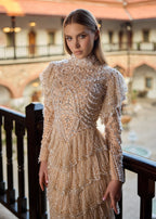 Detailed close-up of the hand-beaded haute couture bridal bodice, showcasing individual hand-sewn pearls, premium crystal details, and a high collar that can be customized to a modern decollete style.