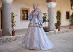 Full-length front view of a luxury ice blue and pastel lavender Turkish henna kaftan dress with structured tiered peplum waist, hand-beaded royal bodice, and elegant sheer chiffon draped sleeves by Sultan Dress.