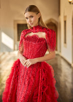 Close-up of the detailed red sequin sweetheart bodice, highlighting the intricate handcrafted high-neck collar with dangling beaded fringes.