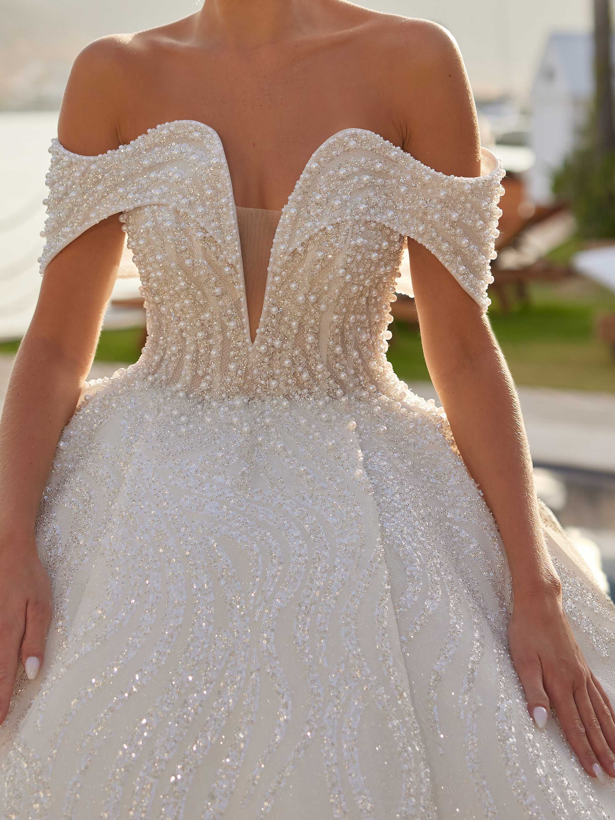 buy Unique Deep V Neck Off The Shoulder White Pearl Bridal Dress. Full pearl embellishments and a chic deep v neck online stores plus sizes
