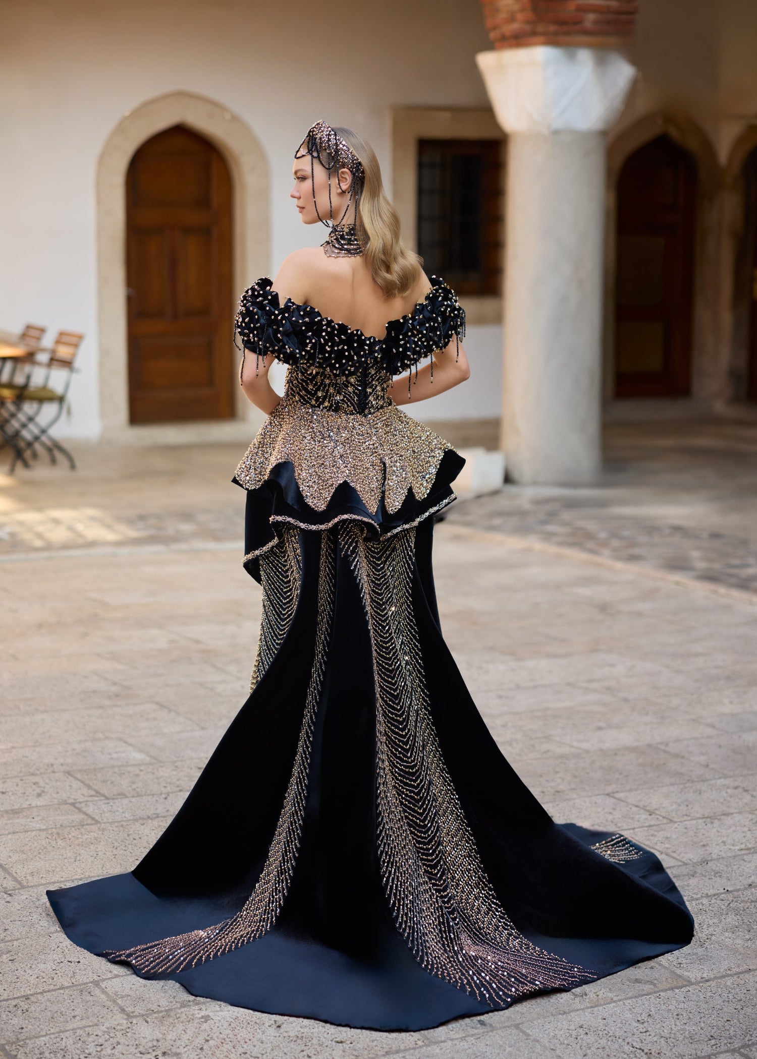 Couture black velvet henna dress with a detachable overskirt, graceful medium-length train, off-the-shoulder puff sleeves, and elegant mermaid silhouette.