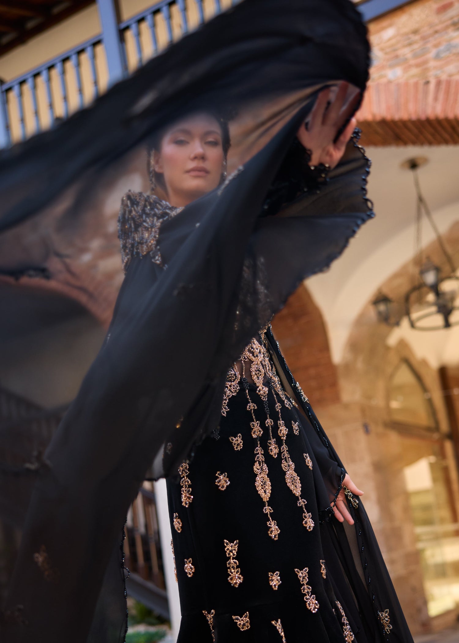 Custom-made black henna dress showcasing detailed handmade beadwork and premium couture craftsmanship.