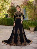 Full-length front view of the elegant black fringed embellished gold lace long henna party gown with crown by Sultan Dress.