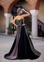 Back view of a custom-made black velvet henna dress with elegant bead embroidery, an A-line silhouette, and handcrafted bridal accessories.