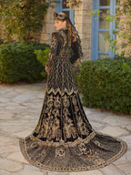 Rear view showing the dramatic gold-embroidered train and high collar on the black velvet modest henna dress.