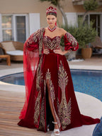 Full-length front view of the luxury red velvet front slit henna gown with gold glitter embroidery, detachable balloon sleeves, matching crown, and choker by Sultan Dress.