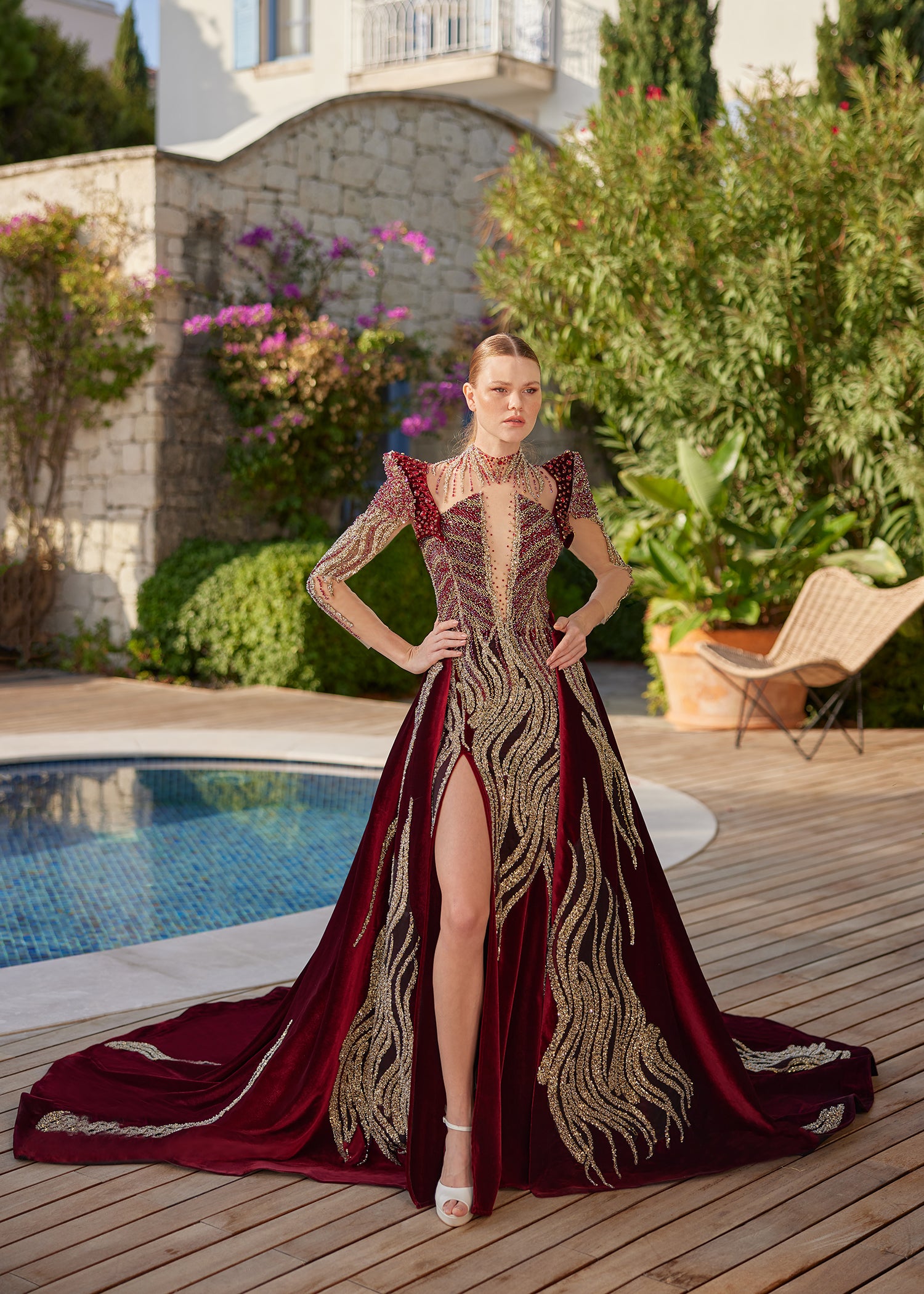 Full-length front view of the stunning beaded sparkly open back mermaid gown with attached velvet overskirt train by Sultan Dress.