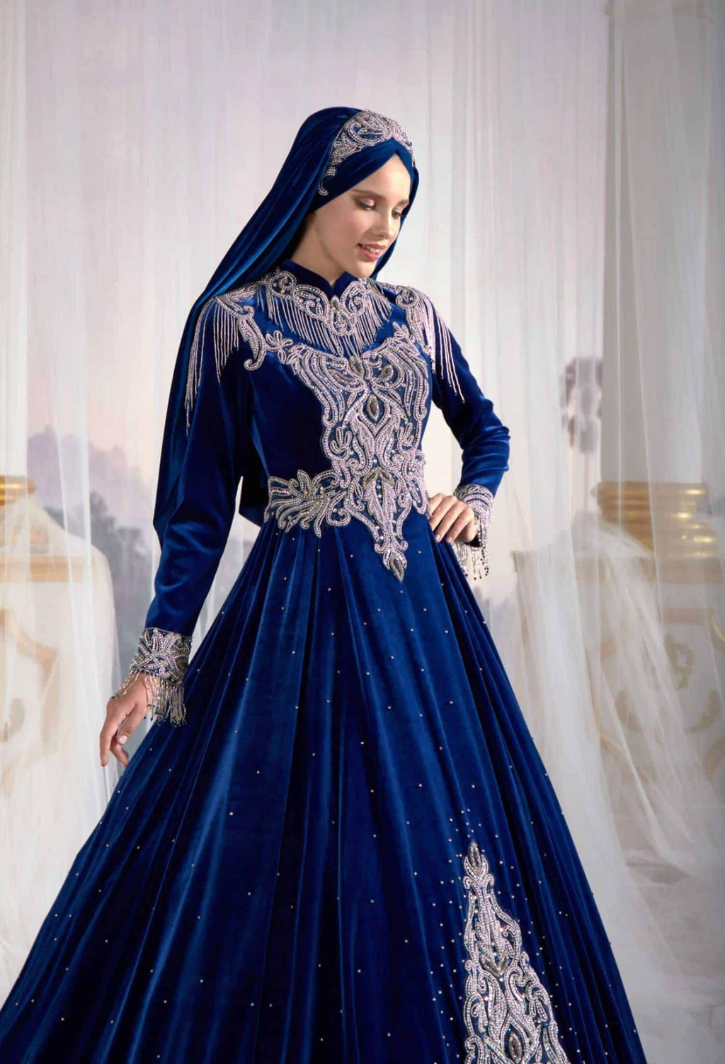 Close-up detail of the artisan hand-beaded crystal embroidery on the dark blue velvet modest evening caftan gown.(4)