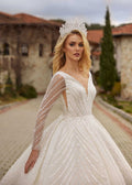 buy Front view showing the beaded sheer illusion long sleeves and V-neckline of the sparkle ball gown by Sultan Dress.