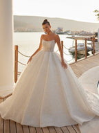 Front view of the pearl embellished strapless ball gown wedding dress with structured corset bodice by Sultan Dress.