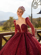 Full-length front view of the burgundy sequin ball gown featuring a plunging sweetheart neckline and long sleeves by Sultan Dress.
