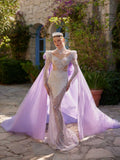 Front view of the white fitted full sequinned long sleeve party dress with high neck choker collar, structured shoulders, and detachable lavender cape train by Sultan Dress.