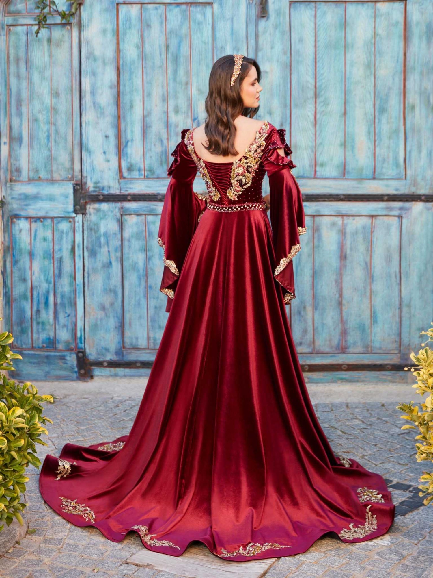 Rear view showing the complete silhouette, dupattta draping, and finish of the Mehndi shalwar kameez suit.