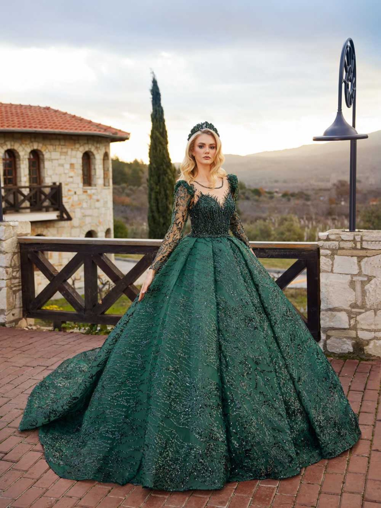 buy Full-length front view showing the emerald green long sleeve ball gown with a beaded illusion neck and sequin princess skirt by Sultan Dress.