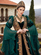 Close-up of the handcrafted gold lace embroidery, crystal beadwork, and neck collar on the emerald green velvet bridal kaftan.