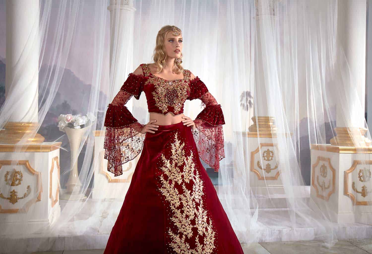 Full-length rear profile displaying the sweeping train and gold-embroidered lace details of the red evening caftan dress.