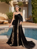 Front view of the black velvet mermaid party dress featuring gold lace borders, beaded fringe sleeve accent, and matching headpiece by Sultan Dress.