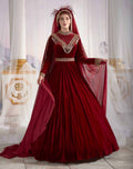 Full-length front view of the dark red long sleeve modest velvet caftan gown featuring an embellished high neckline for Muslim brides by Sultan Dress.