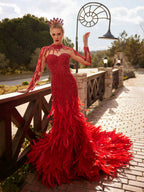 Close-up of the handcrafted red crystal beadwork, illusion neck, and cascading feather detailing.