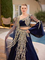 Close-up of the handcrafted gold sequin filigree embroidery, high-waist velvet waistband, and crop top bodice details.