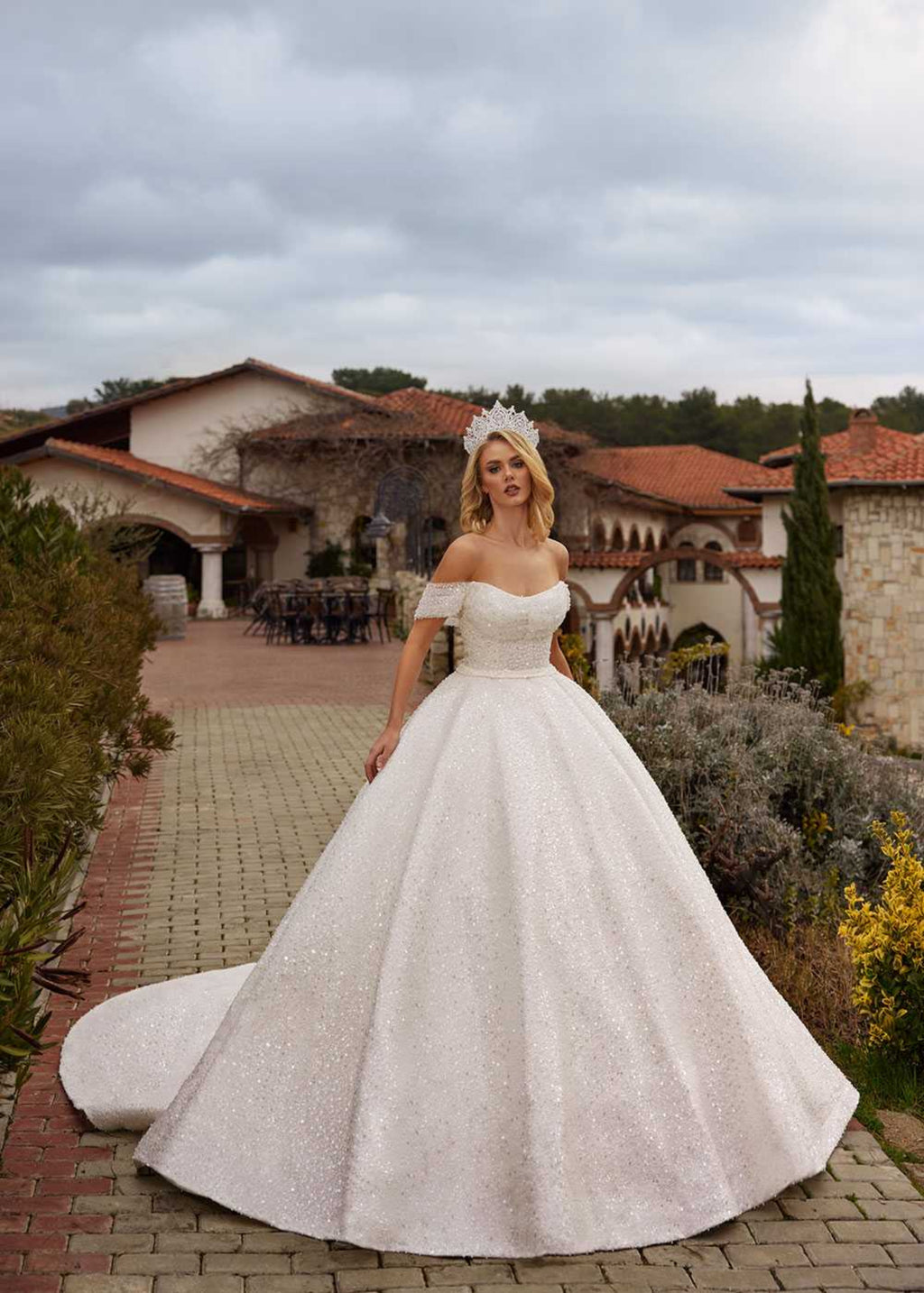 Front view showing the off-the-shoulder beaded straps and sweetheart pearl corset of the sparkle ball gown by Sultan Dress.
