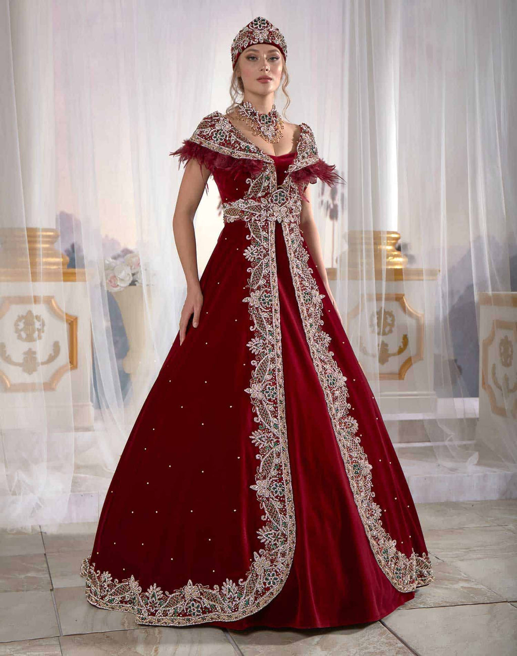 Full-length front view of the red and navy velvet blue soft drape delicate embellished caftan dress by Sultan Dress.