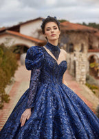 Full-length front view showing the asymmetrical one-shoulder puff sleeve, neckband accessory, and sparkling sequin ball gown skirt by Sultan Dress.